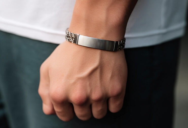 man wearing id bracelet